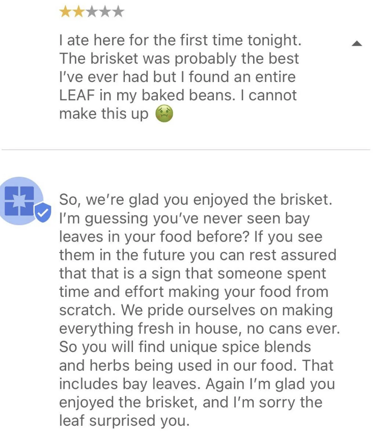 Image with two online reviews praising a restaurant, focusing on the brisket and bay leaves&#x27; inclusion in the food