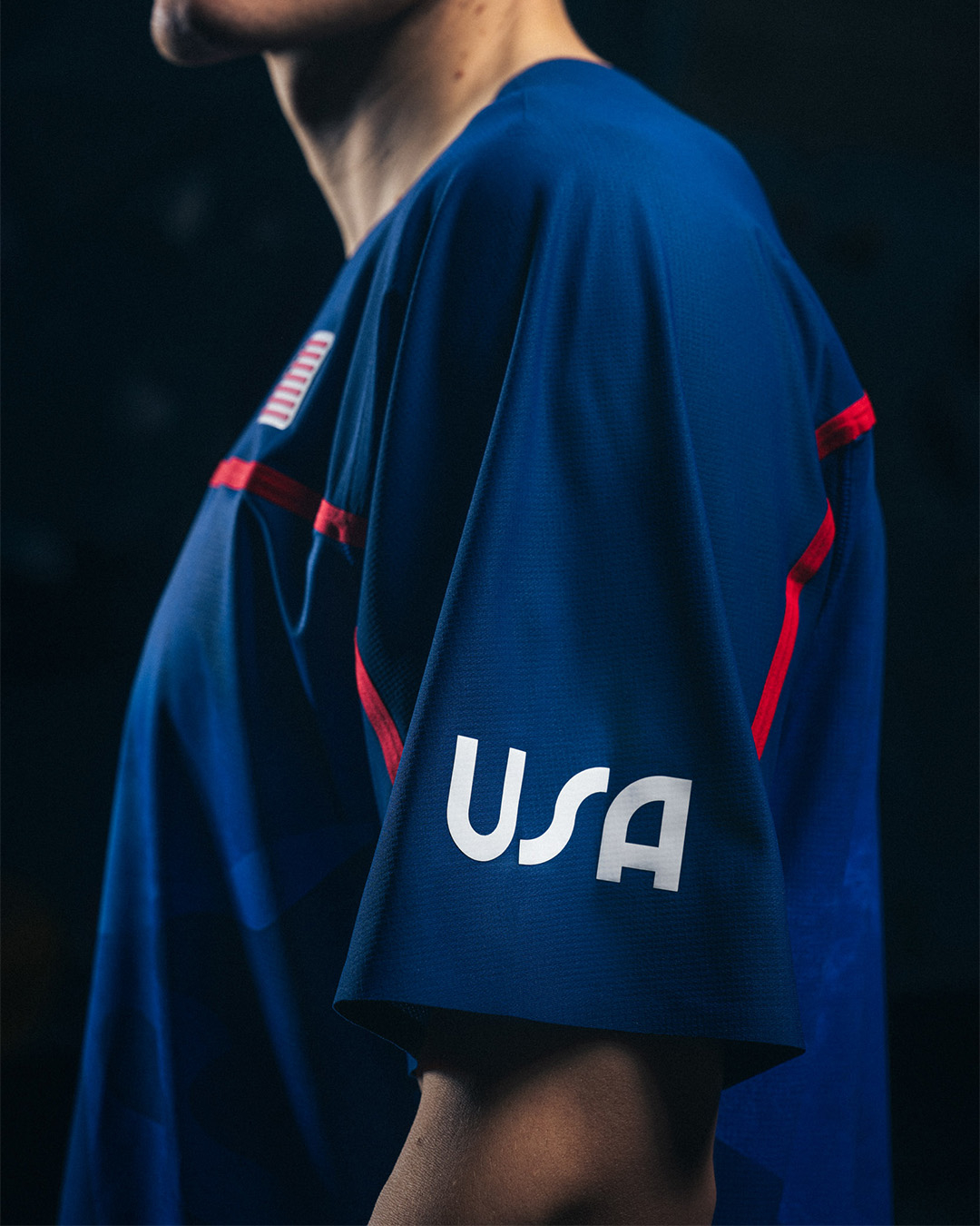 Athlete in Team USA uniform with &quot;USA&quot; logo on the sleeve
