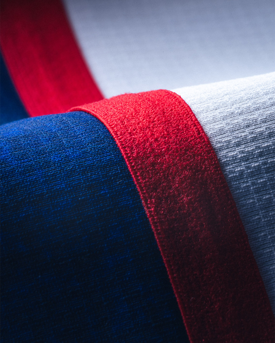 Close-up of a red, white, and blue fabric with different textures