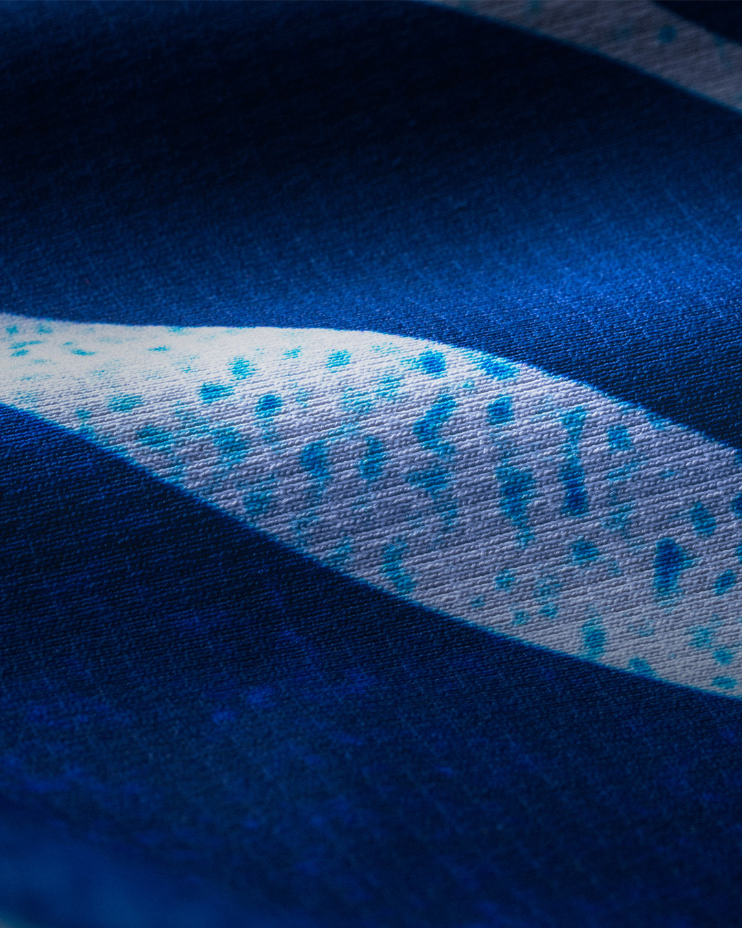 Close-up of textured fabric with abstract design, relevant for fashion discussion