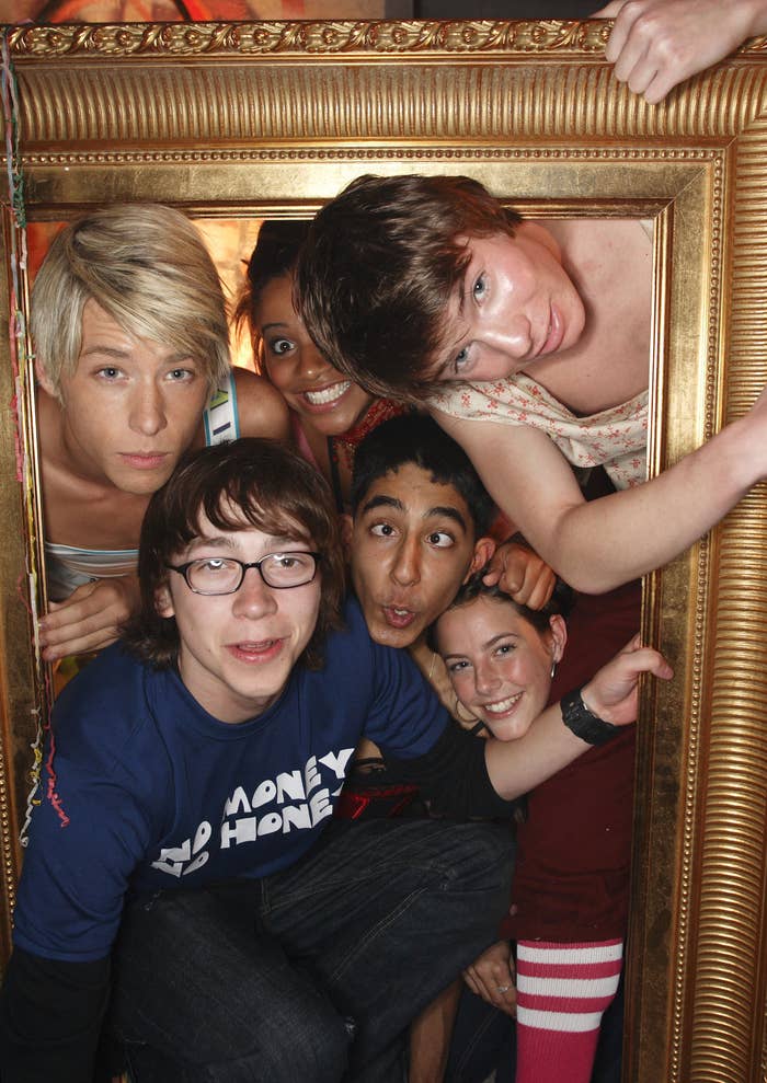 The cast of &quot;Skins&quot; in a promo photo as they all stand inside a massive picture frame