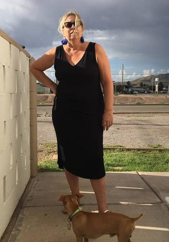 Reviewer successful the achromatic sleeveless formal stands with a canine connected a leash