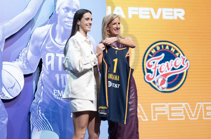Caitlin Clark receiving her Indiana Fever jersey