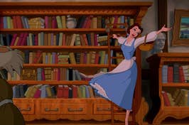 Belle from Beauty and the Beast in a library, joyfully surrounded by books, with Beast's shadow visible