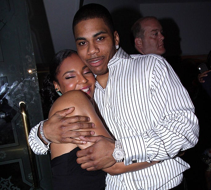 Closeup of Ashanti and Nelly hugging