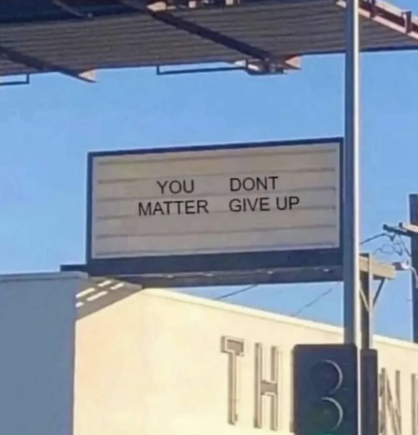 Billboard with text &quot;YOU DON&#x27;T MATTER GIVE UP&quot; possibly missing punctuation