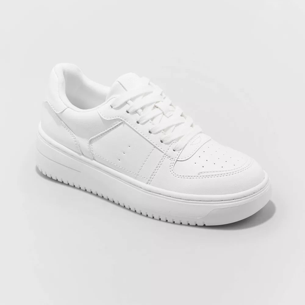 A single white classic style sneaker displayed against a light background