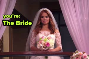 Debby Ryan in a wedding dress as her character on set, holding a bouquet with text "you're: The Bride" above her
