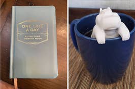 Journal titled "One Line a Day" beside a mug with a hippo figure inside