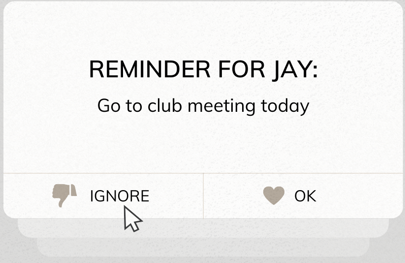 Notification on screen reading &quot;REMINDER FOR JAY: Go to club meeting today&quot; with options to ignore or OK