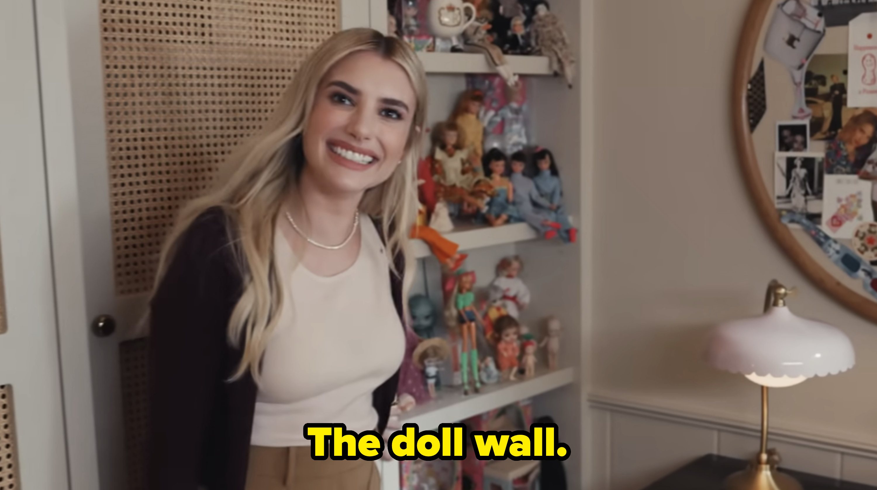 Emma Roberts showing her doll wall