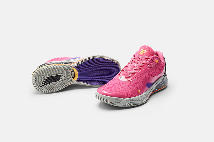 Pink basketball sneakers with a speckled design and visible brand logo
