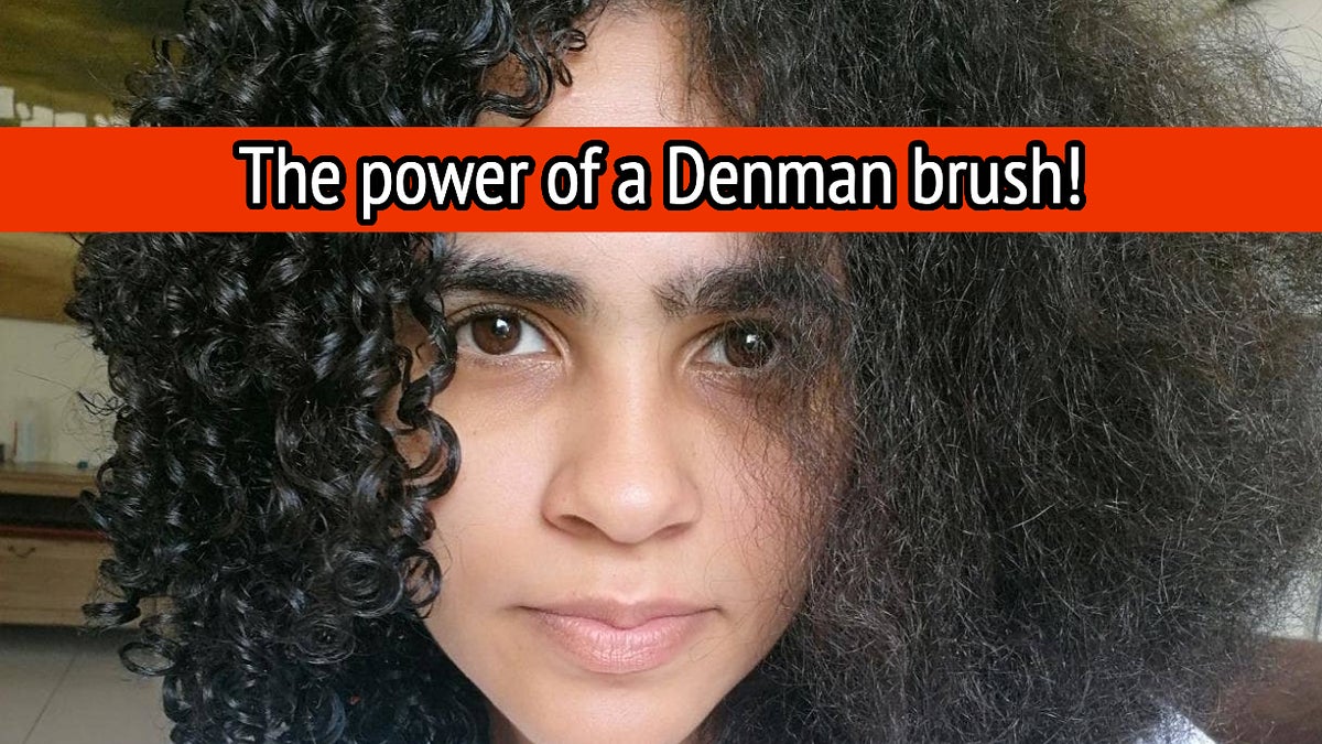 Person showing half-brushed curly hair with a Denman brush for comparison and text reading "The power of a Denman brush!"