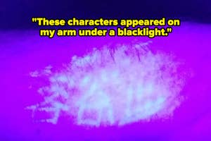 Fluorescent markings on skin visible under blacklight, resembling characters