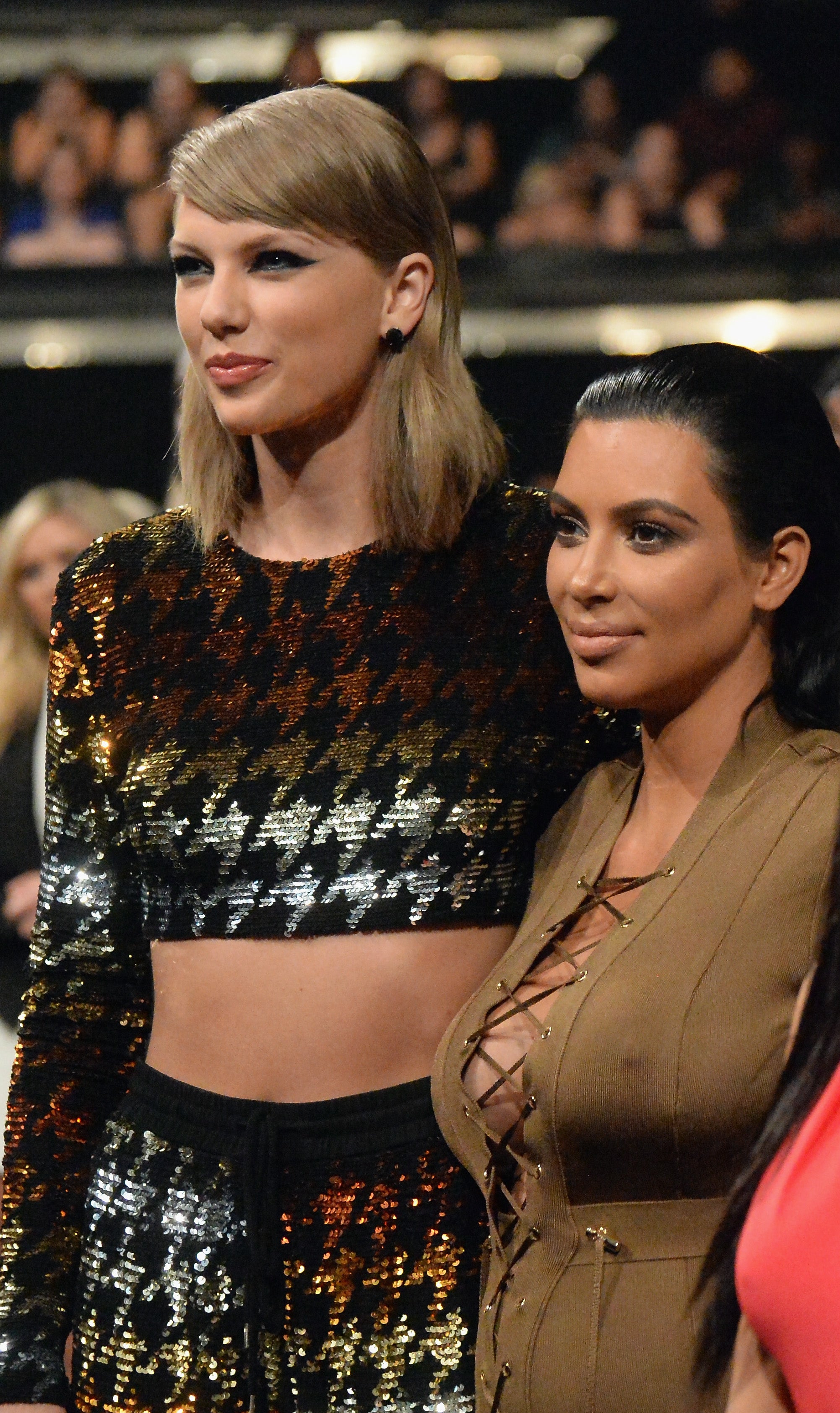 Taylor Swift and Kim Kardashian standing side by side