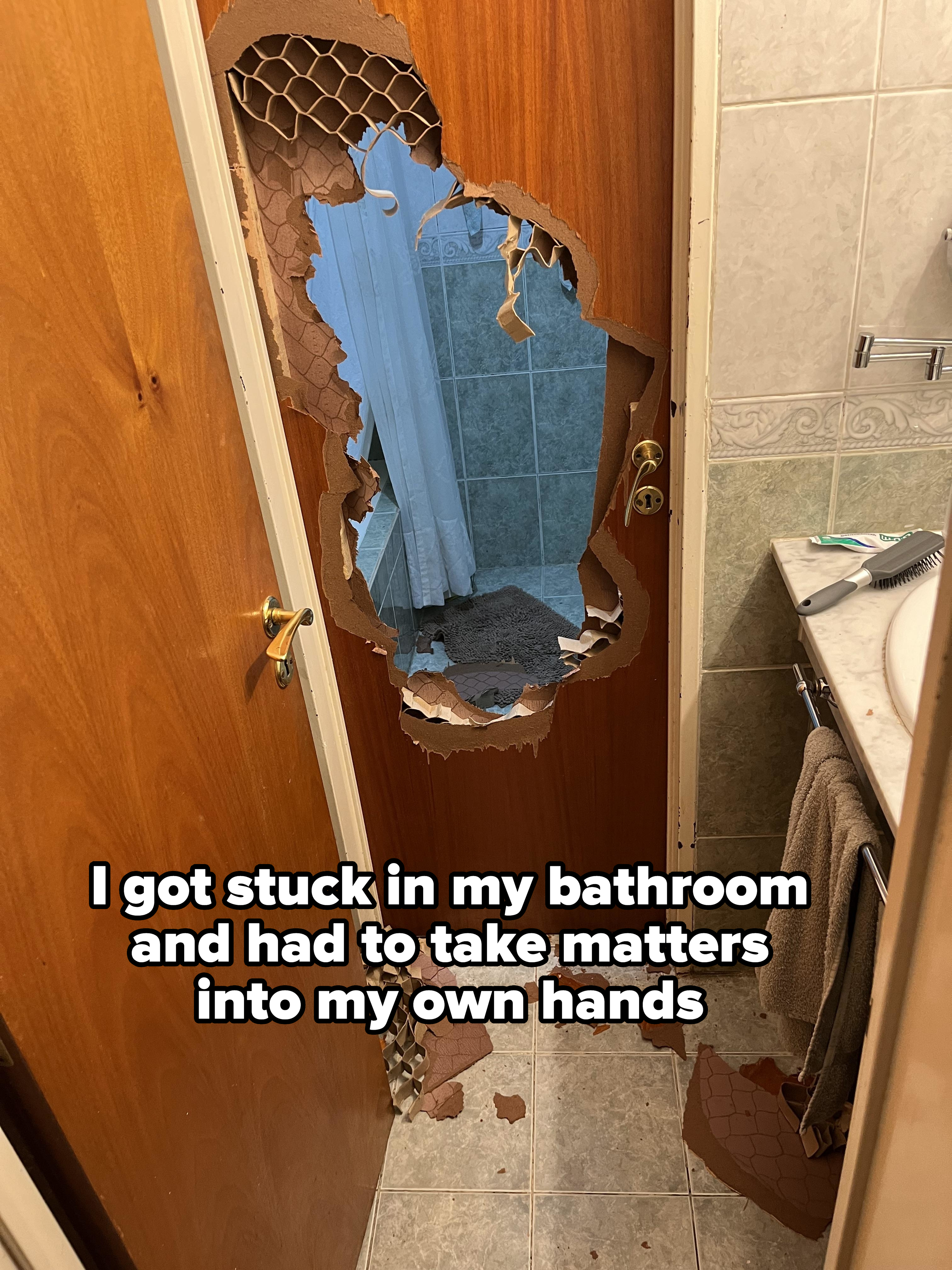 Bathroom door with a large, irregular hole revealing towels and shower curtain inside