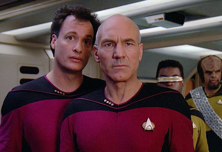Cast of Star Trek: The Next Generation on the bridge, including Captain Jean-Luc Picard and Commander Data in uniform