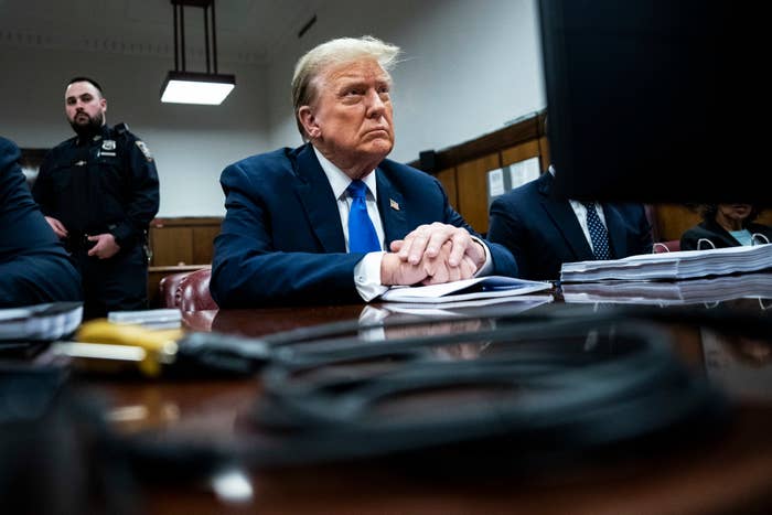 Donald Trump seated in court