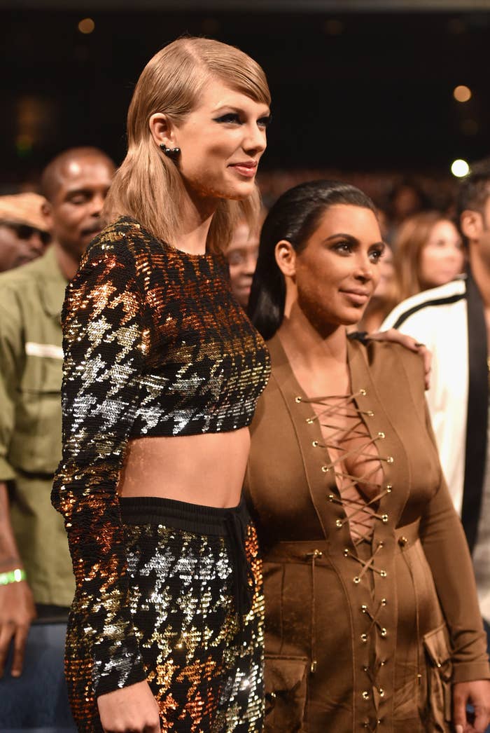 Taylor Swift and Kim Kardashian standing side by side