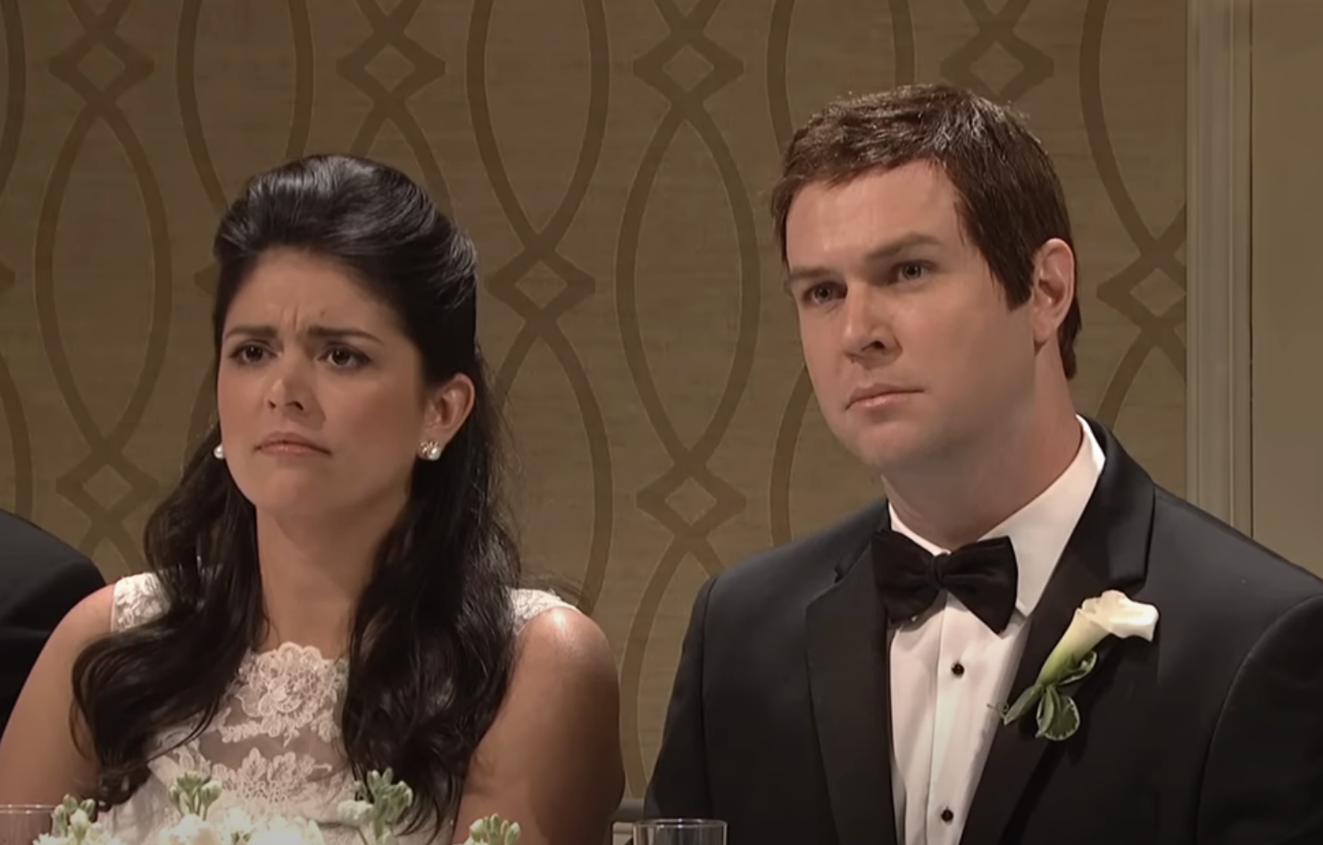 Two characters, a bride and groom, looking displeased at a wedding reception