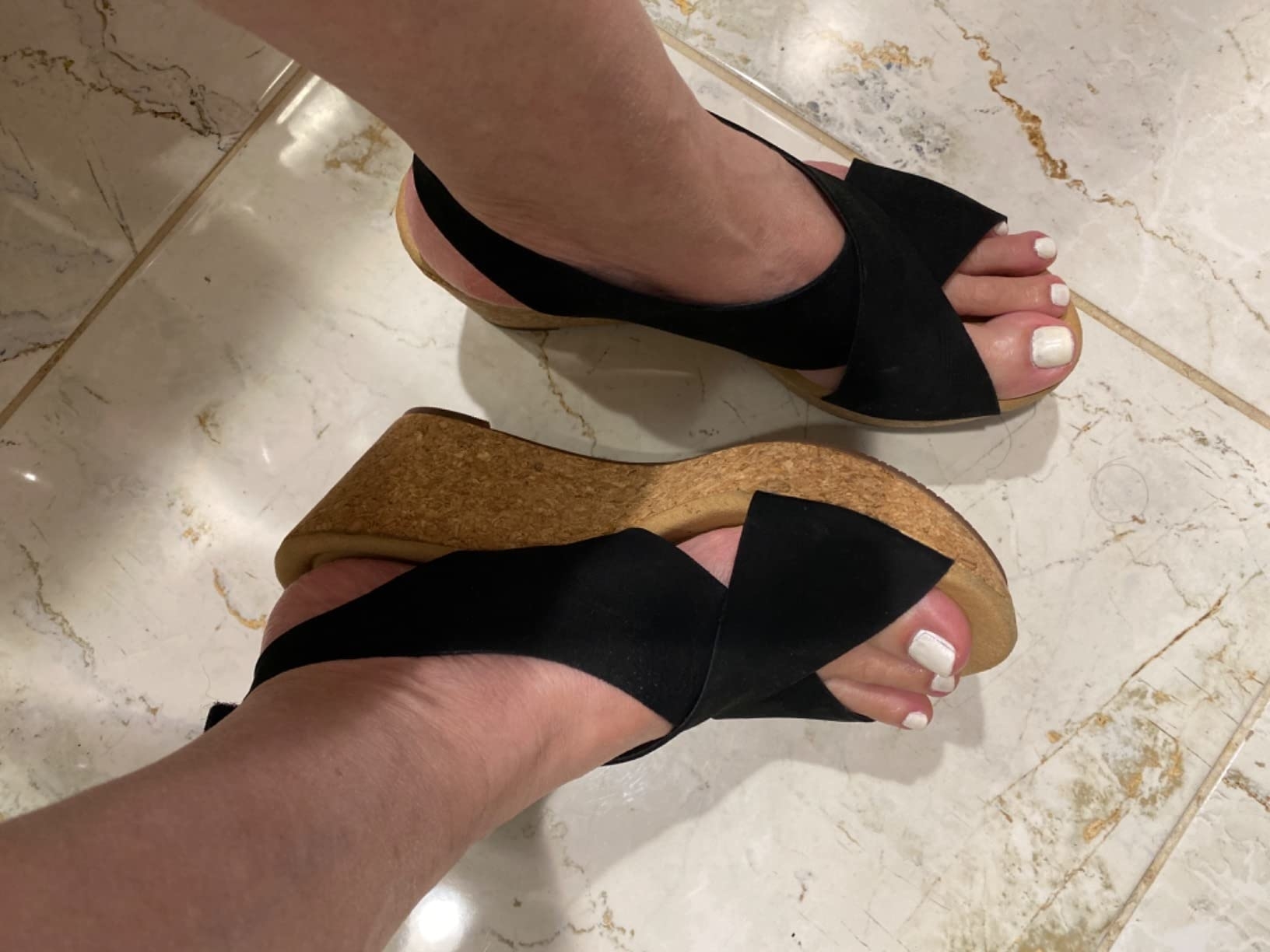 Person wearing platform sandals, with a close view of the feet