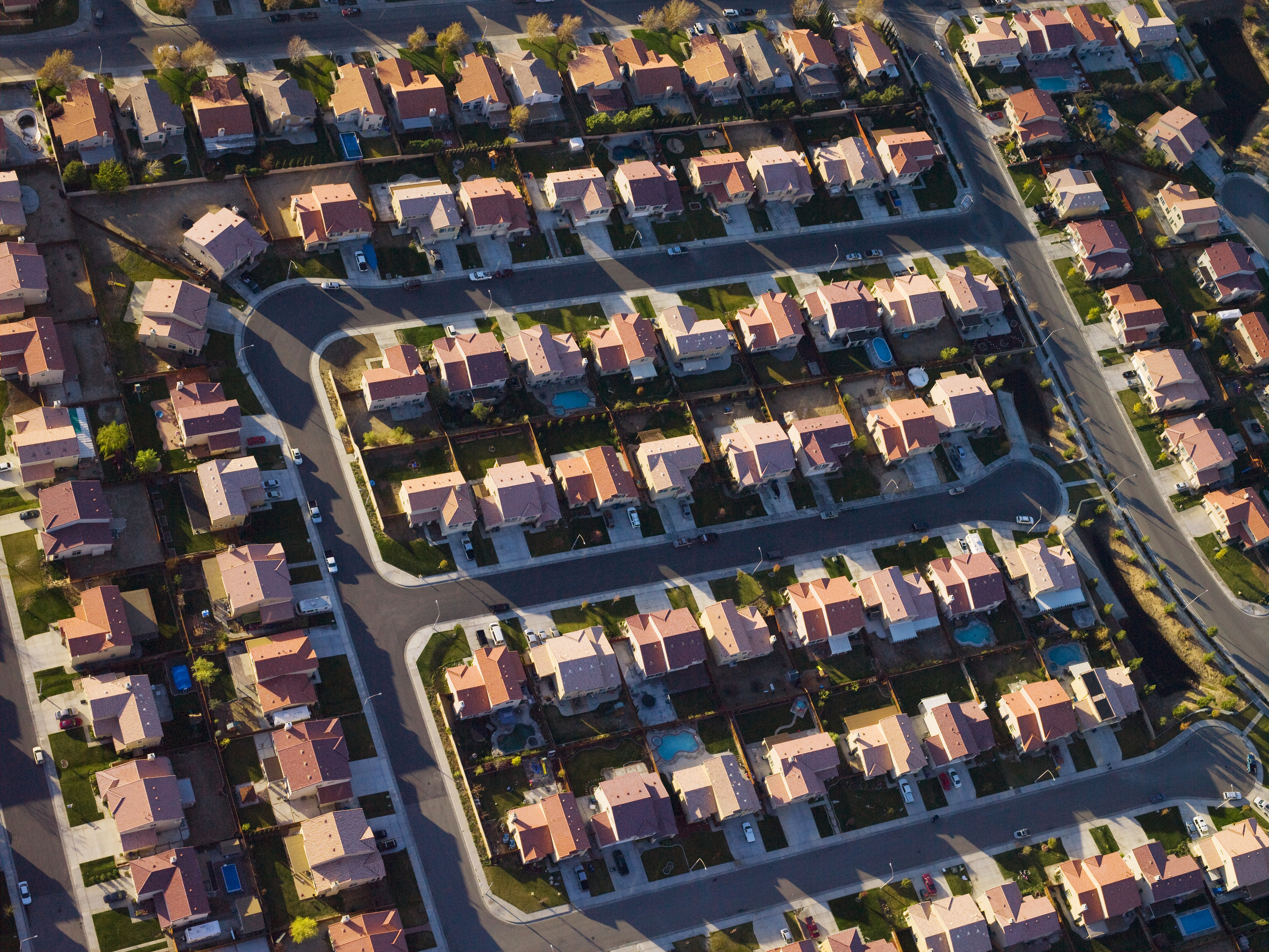 Aerial view of a suburban neighborhood with uniform houses