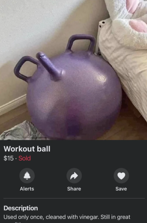 A purple workout ball for sale is pictured beside a bed with a pink toy in a room