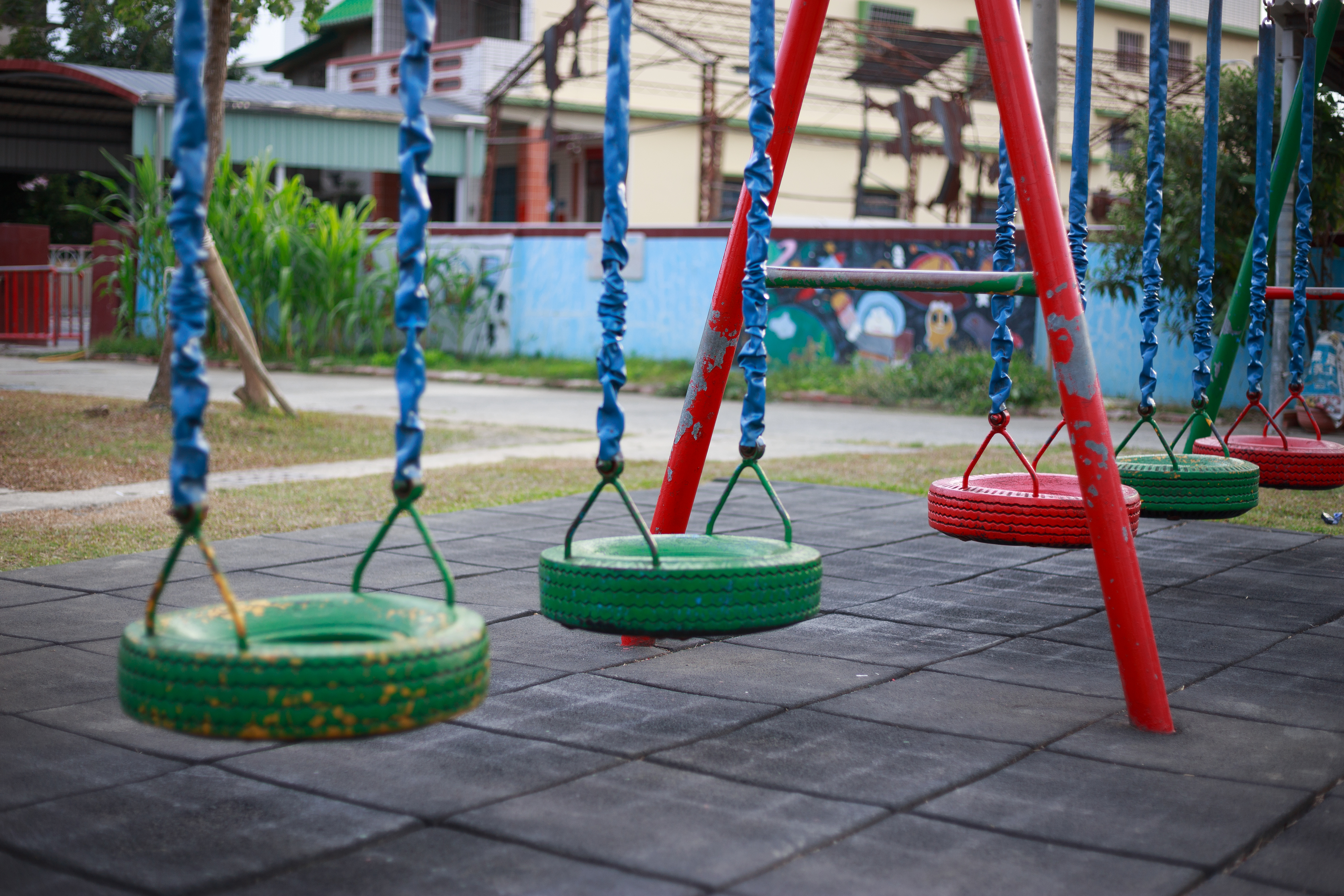Empty tire swings hanging in a playground