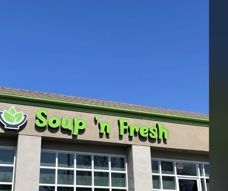 Storefront of &#x27;Soup n&#x27; Fresh&#x27; with a green sign above the entrance