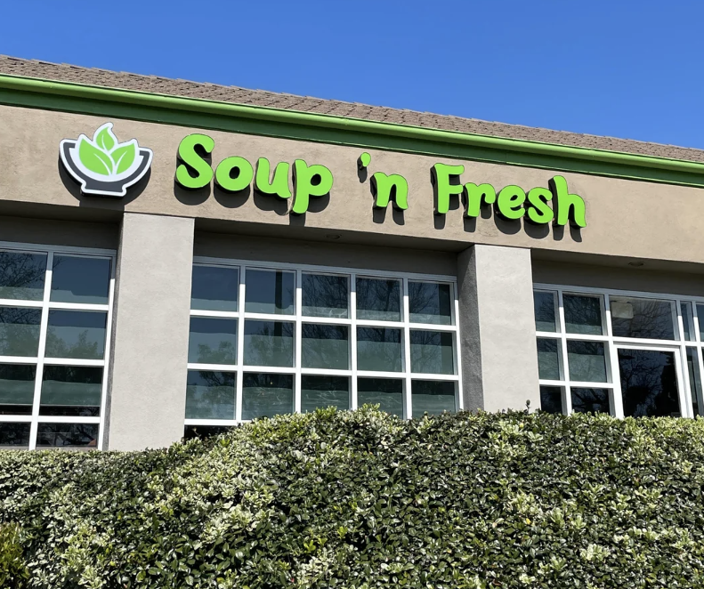Storefront of &#x27;Soup n&#x27; Fresh&#x27; with a green sign above the entrance
