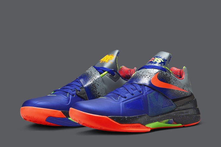 A pair of vibrant, multi-textured sneakers with a unique design on a plain background