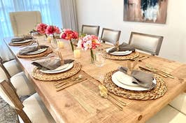 Reviewer's beautiful dining table is set with the gold silverware