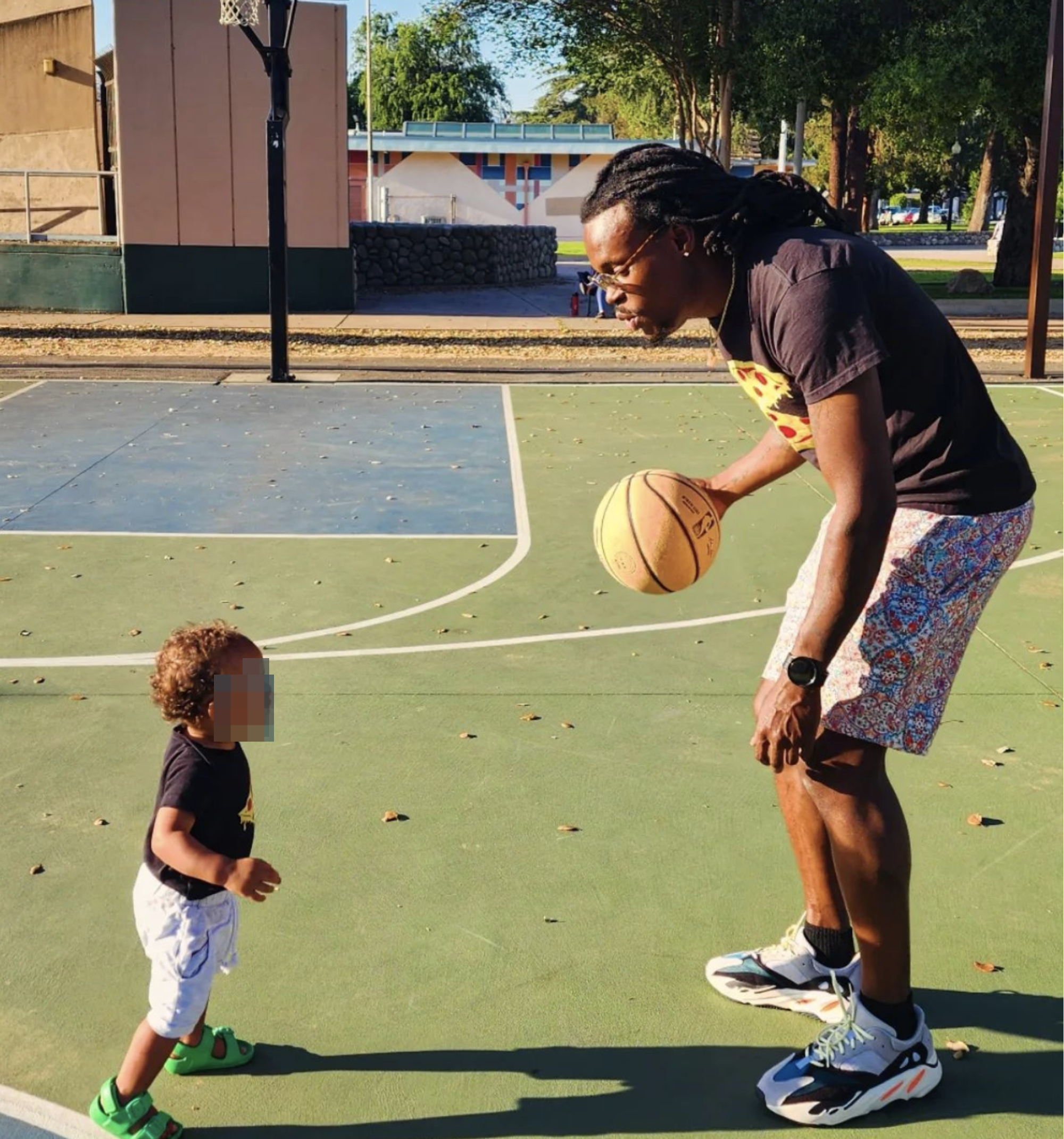The author playing basketball with his son