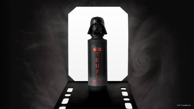 Darth Vader themed water bottle with "Star Wars" and "TRUFFLE" text, spotlighted between smoke swirls against a dark backdrop