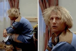 Jeff Daniels looking distressed sitting on a toilet