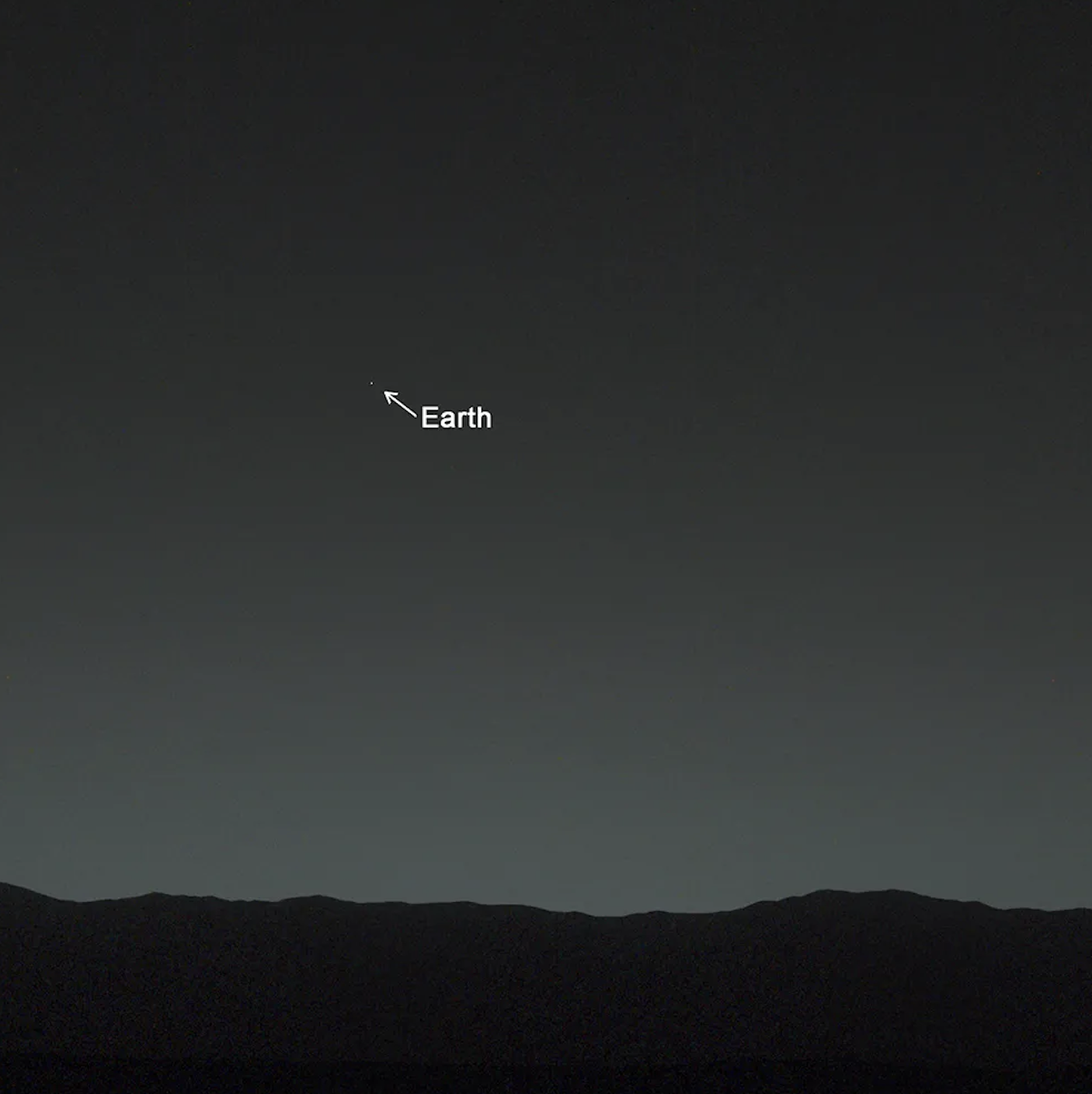 Pale Blue Dot photo of Earth taken from Voyager 1, with Earth as a tiny speck in vast darkness
