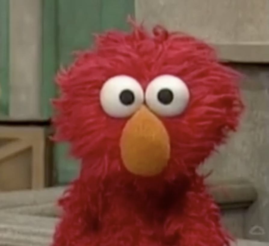 Close-up of Elmo from Sesame Street with a surprised expression