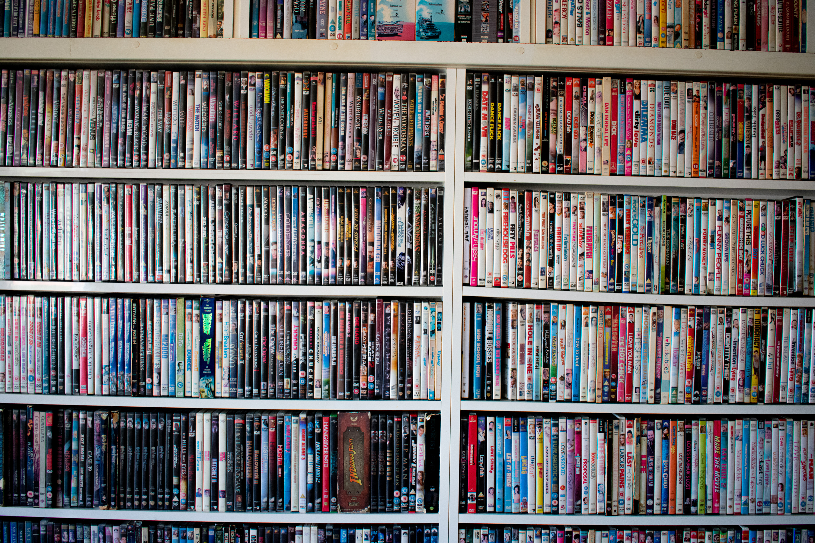 Shelves filled with an extensive collection of DVDs and Blu-rays