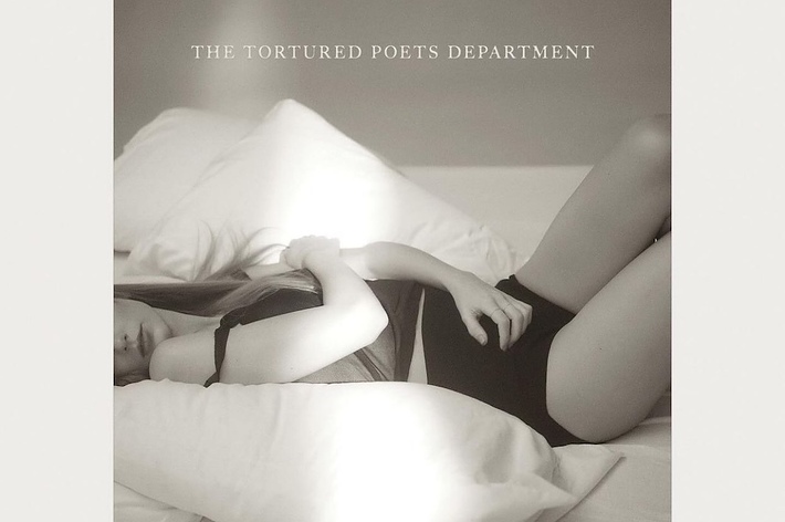 Album cover with text 'THE TORTURED POETS DEPARTMENT' and a person lying on a bed hugging their knees