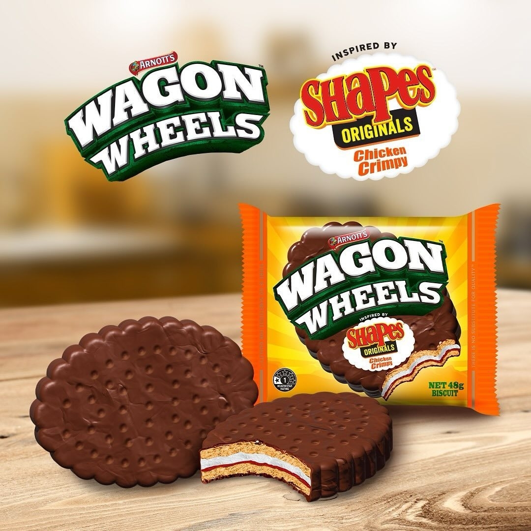 Package of Wagon Wheels biscuits next to two biscuits, one whole and one half, with a Shapes Chicken Crimpy flavor sign