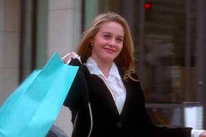 A character smiling and holding shopping bags
