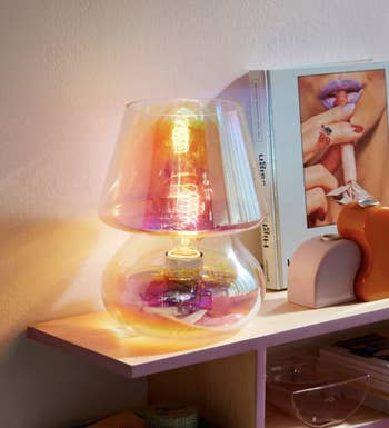 iridescent glass lamp on modern shelf