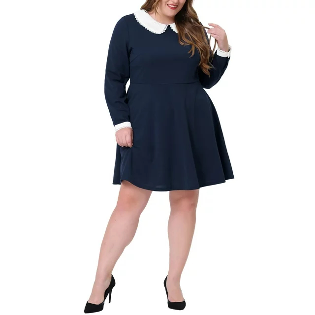 Model in a navy dress with white collar and cuffs, paired with black heels