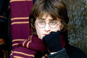Daniel Radcliffe as Harry Potter in a scene, wearing glasses and a Gryffindor scarf
