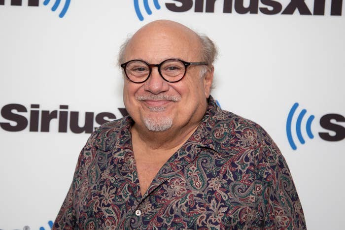 Smiling man in a patterned shirt posing at a SiriusXM event