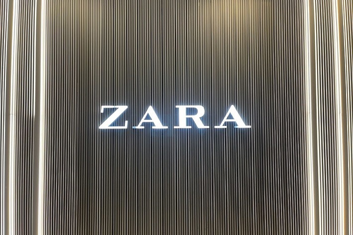 Storefront sign for Zara with vertically lined background