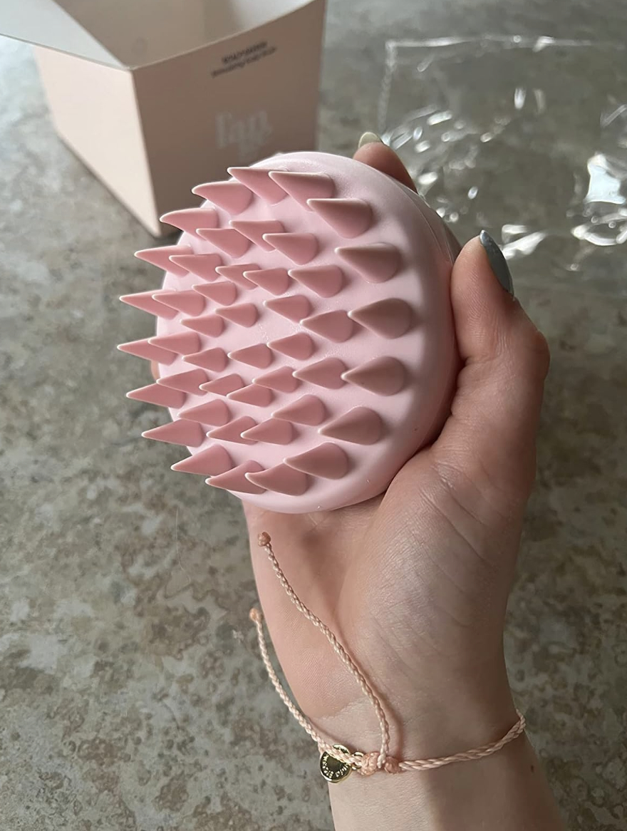 hand holding textured silicone brush