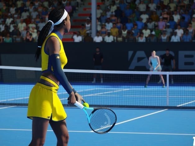 Naomi Osaka in a tennis outfit playing at a tournament, holding her racket, with spectators in the background