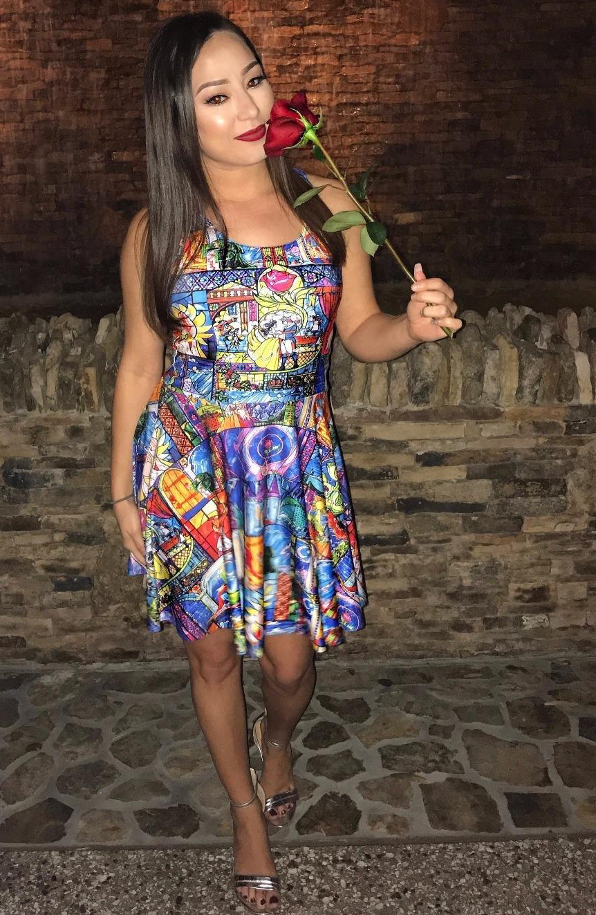Reviewer wearing the beauty and the beast stain glass style print dress