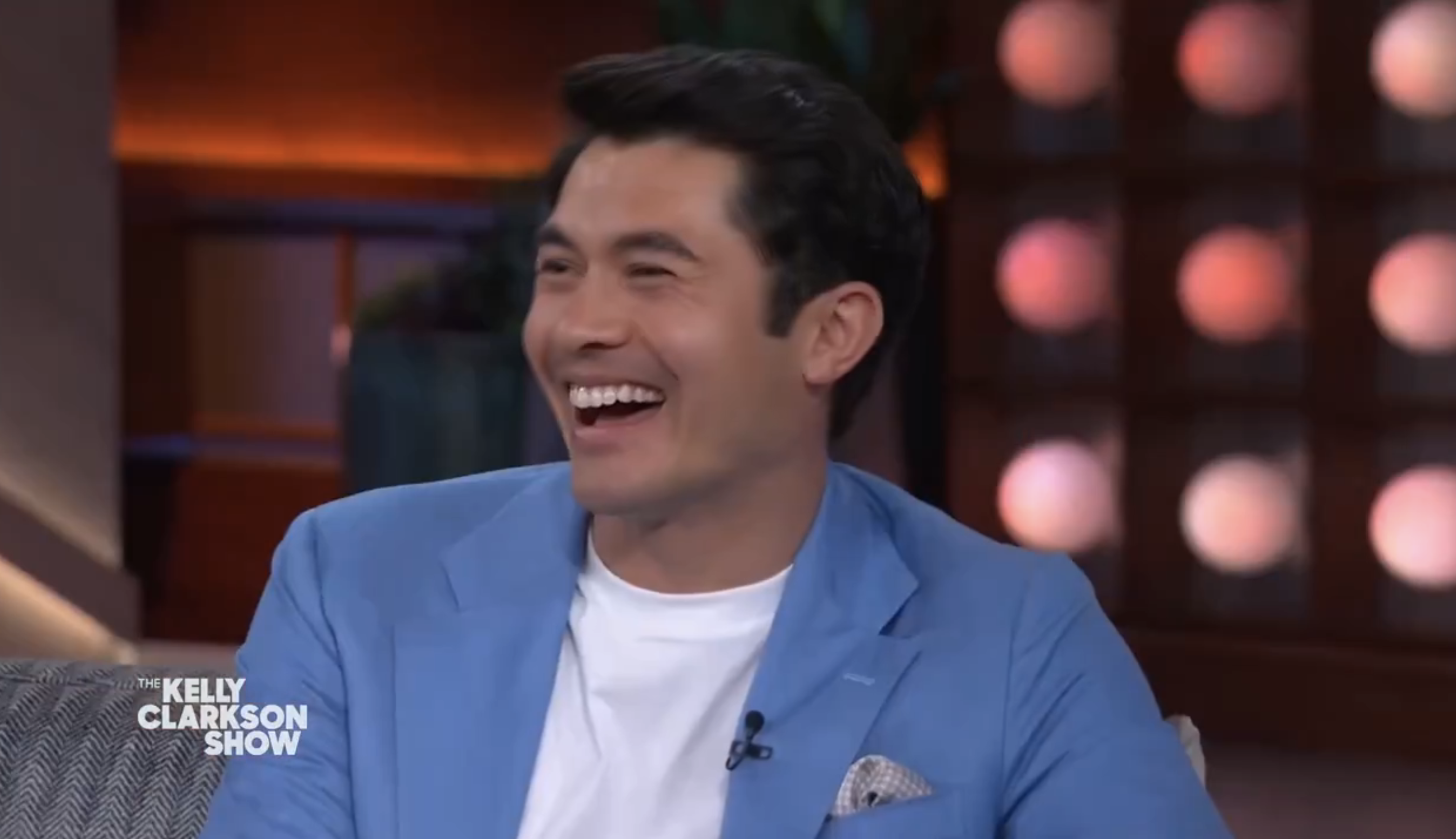 Closeup of Henry Golding laughing